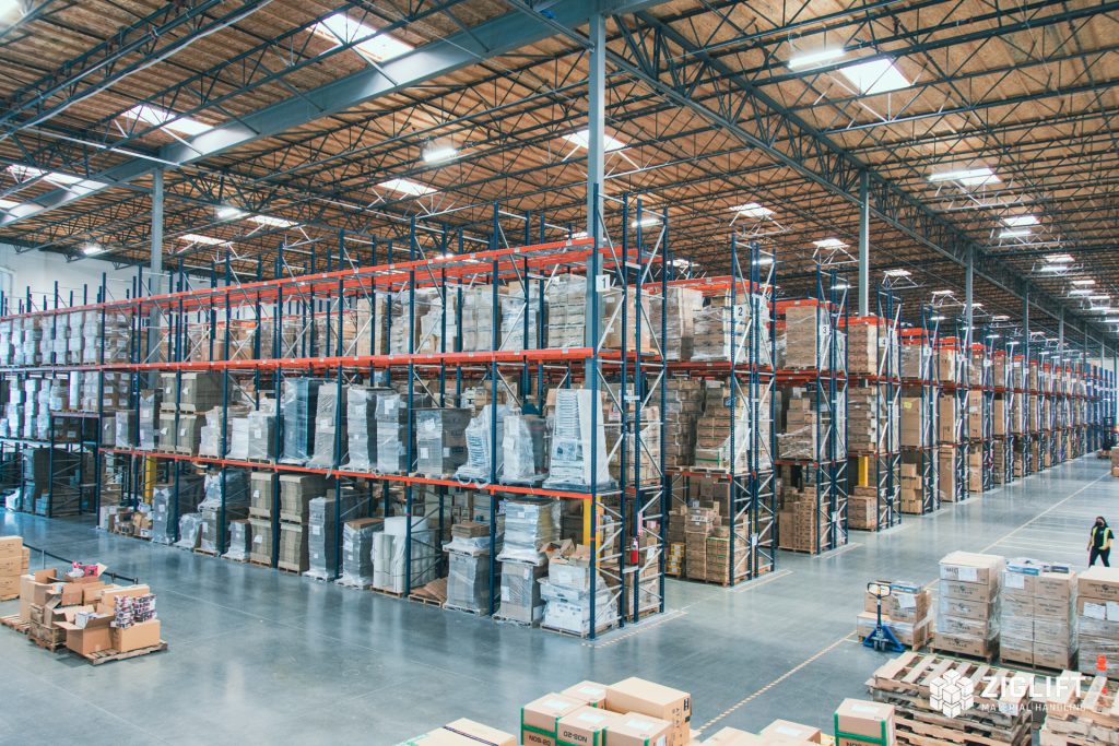 Rows of industrial pallet racks loaded with pallets in a Houston warehouse