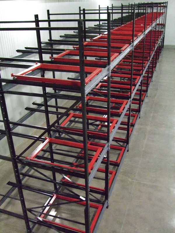 Black and red pushback racking system with nested carts